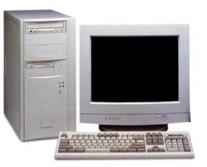 Image of a fifth-generation desktop computer with a white tower CPU, CRT monitor, and a matching keyboard, representing advancements in computing technology.